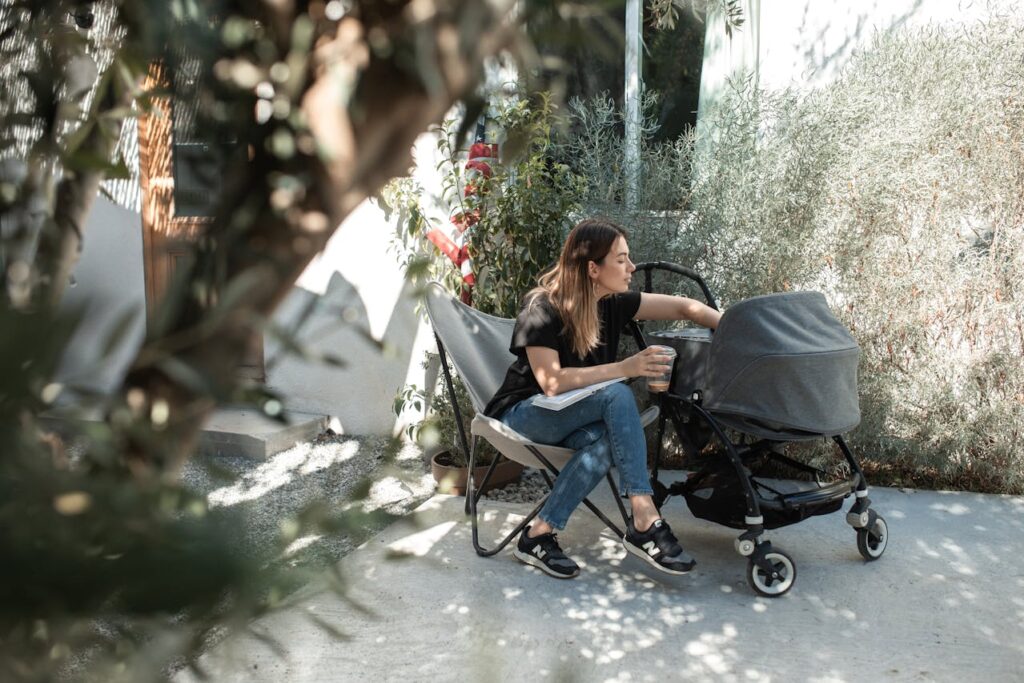 Baby sleeping in stroller at a hotel in Athens with mother relaxing